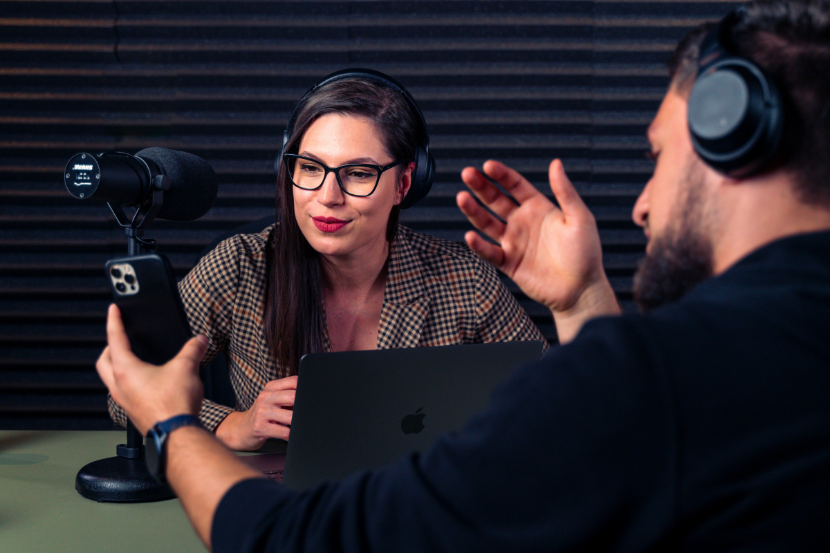 two people recording a podcast