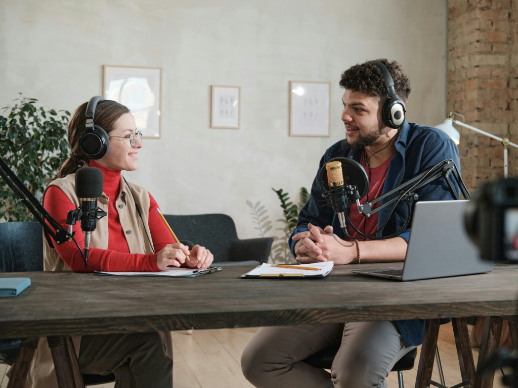 Two people recording a podcast